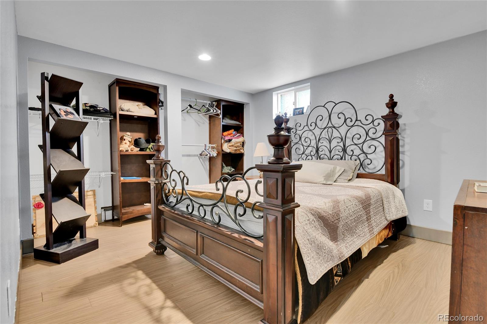 1632 Kiowa-Bennett Road Bennett, CO 80102 - Photo 18 of 42 a bedroom with bed and a large mirror