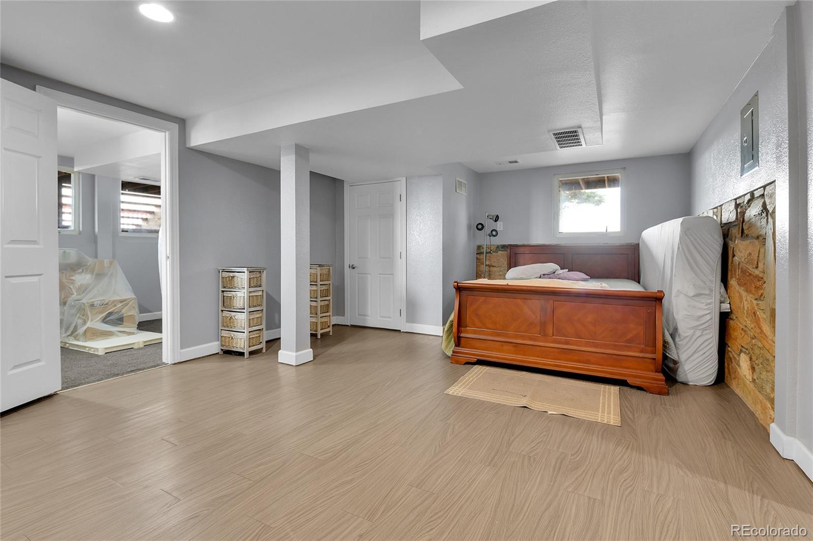 1632 Kiowa-Bennett Road Bennett, CO 80102 - Photo 22 of 42 a bedroom with a bed and ceiling fan