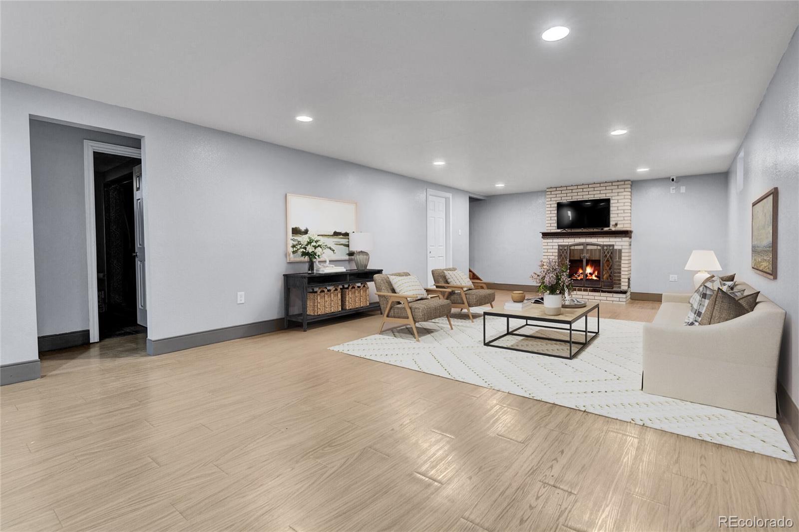 1632 Kiowa-Bennett Road Bennett, CO 80102 - Photo 24 of 42 a living room with furniture and a flat screen tv