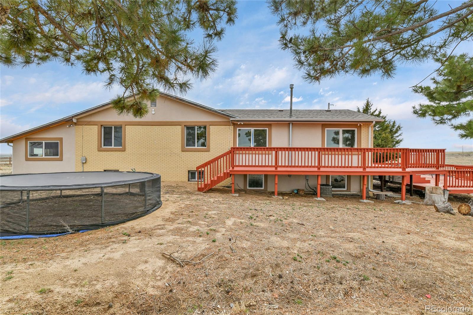 1632 Kiowa-Bennett Road Bennett, CO 80102 - Photo 31 of 42 a view of a house with a yard and roof