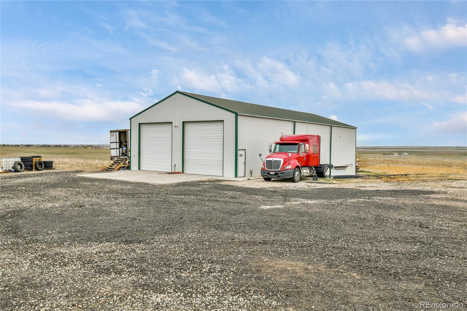 1632 Kiowa-Bennett Road Bennett, CO 80102 - Photo 32 of 42 a view of a house with a outdoor space