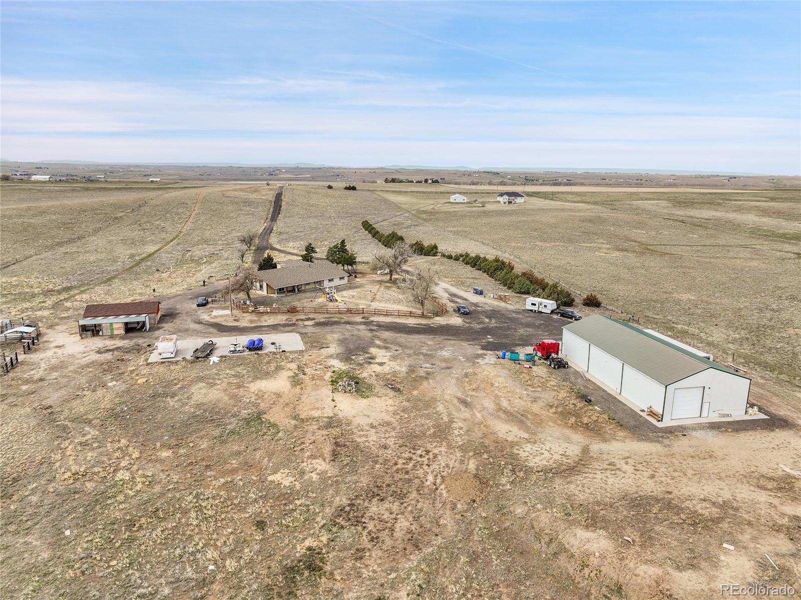 1632 Kiowa-Bennett Road Bennett, CO 80102 - Photo 40 of 42 an aerial view of beach and ocean