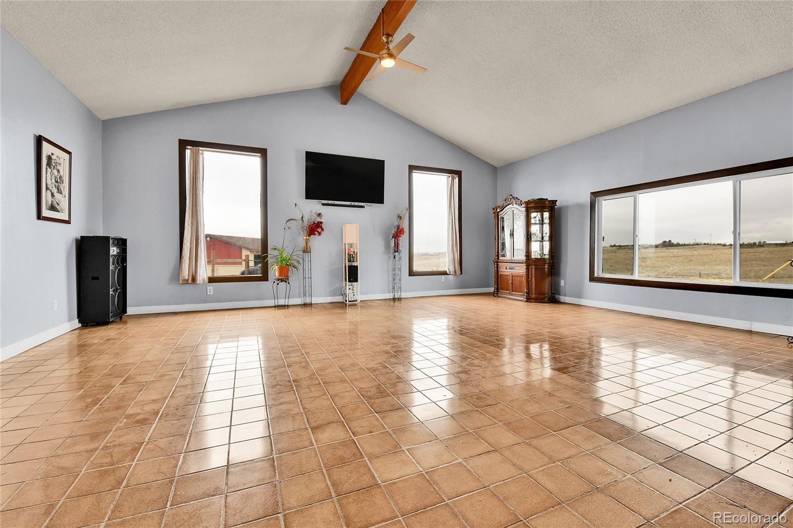 1632 Kiowa-Bennett Road Bennett, CO 80102 - Photo 5 of 42 a view of a livingroom with an empty space and a window