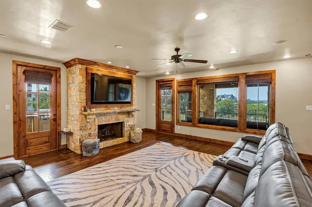 a living room with furniture fireplace and flat screen tv
