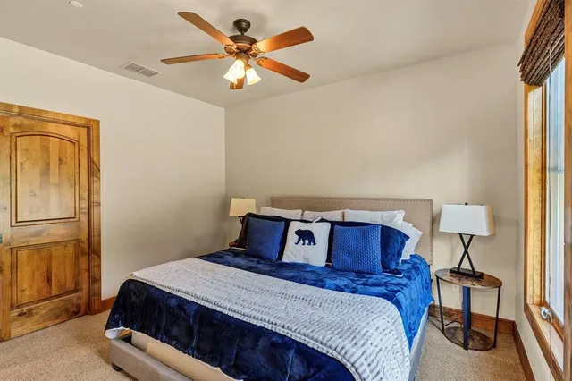 a bedroom with a bed and a table