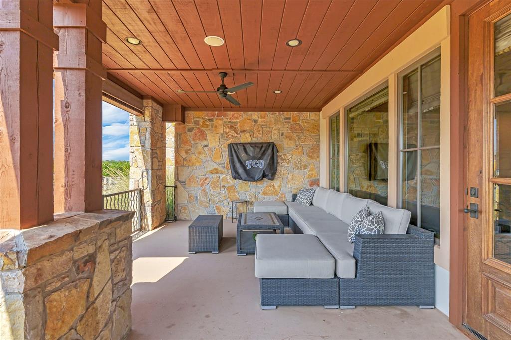 1693 Scenic Drive, Unit 101 Graford, TX 76449 - Photo 25 of 35 a living room with furniture and a large window