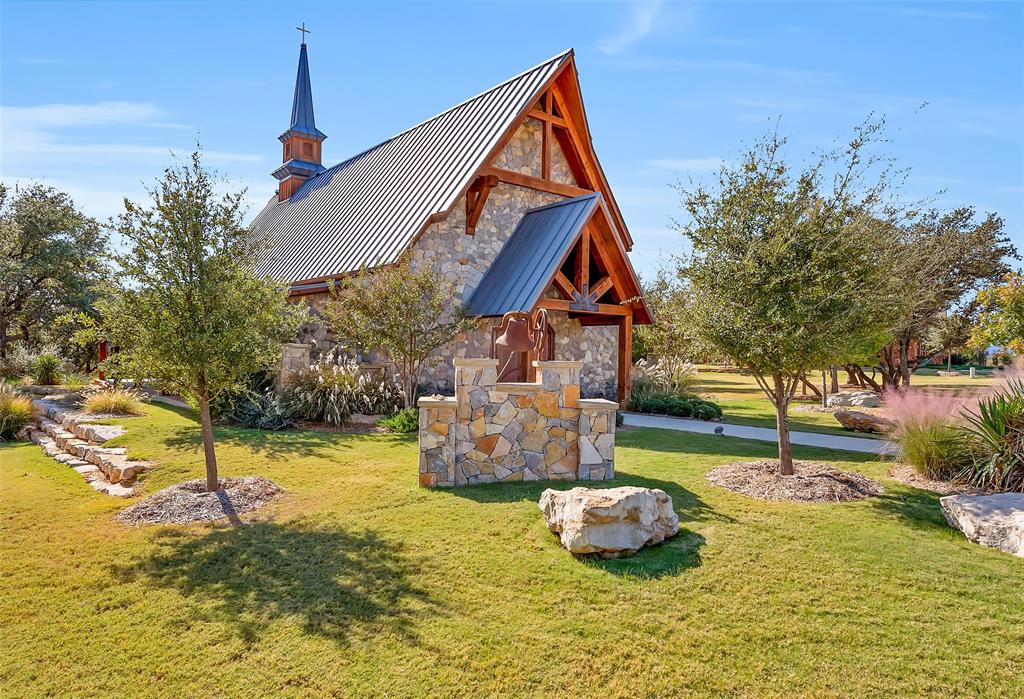 1693 Scenic Drive, Unit 101 Graford, TX 76449 - Photo 35 of 35 a front view of a house with garden