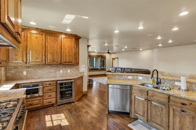 a kitchen with wooden cabinets and a sink