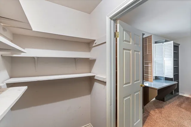 a bathroom with a granite countertop sink mirror toilet and bathtub
