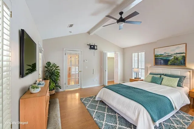 a bathroom with a granite countertop tub sink and mirror