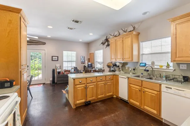 a dining room with furniture window and wooden floor