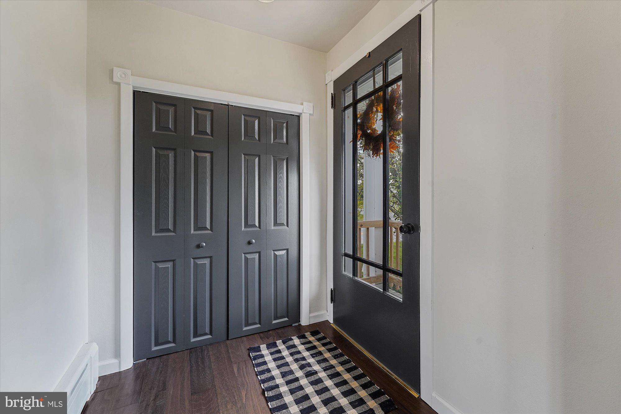 334 Quarry Road Peach Bottom, PA 17563 - Photo 21 of 48 Front door & closet off living room with fireplace