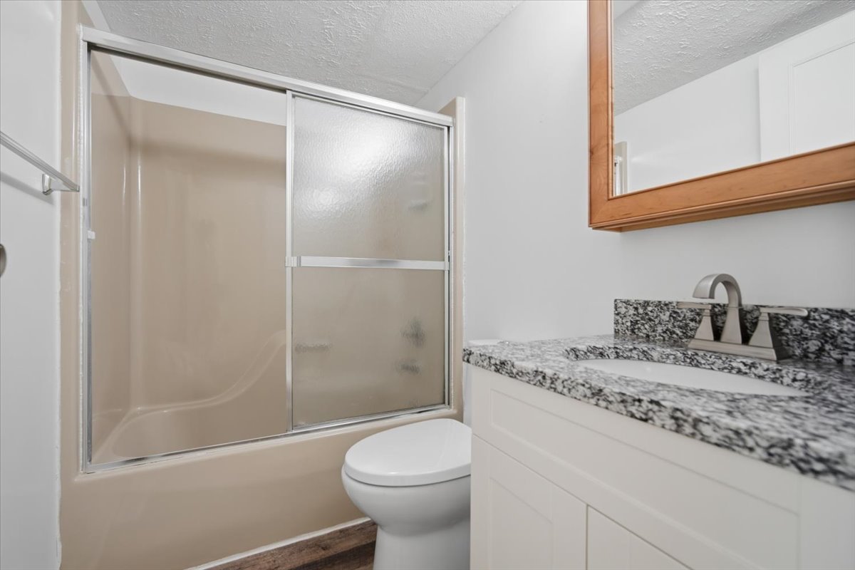 1600 Northbrook Drive, Unit B9 Normal, IL 61761 - Photo 11 of 24 a bathroom with a granite countertop sink toilet and shower