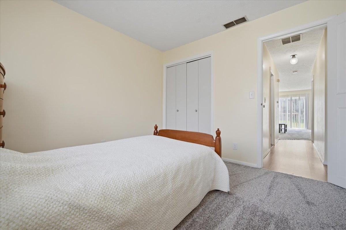 1600 Northbrook Drive, Unit B9 Normal, IL 61761 - Photo 13 of 24 a bedroom with a bed and closet