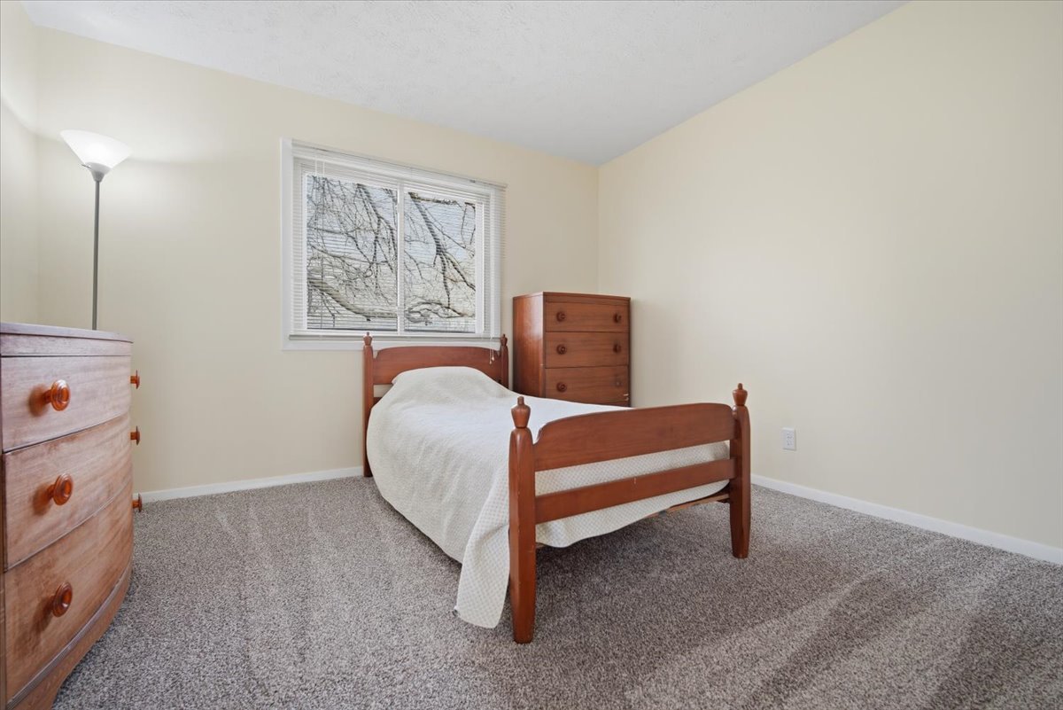 1600 Northbrook Drive, Unit B9 Normal, IL 61761 - Photo 14 of 24 a bedroom with a bed and a window