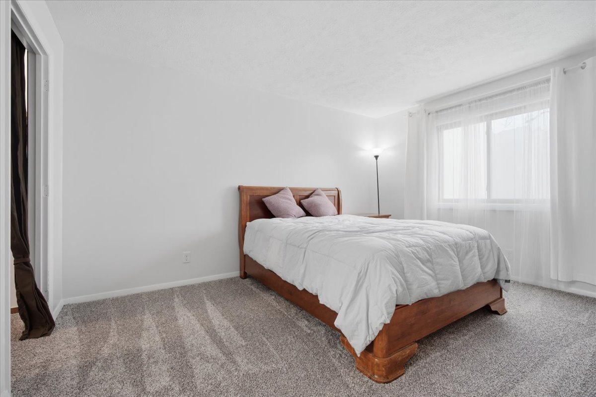 1600 Northbrook Drive, Unit B9 Normal, IL 61761 - Photo 16 of 24 a bedroom with a bed and a window