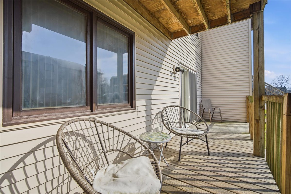 1600 Northbrook Drive, Unit B9 Normal, IL 61761 - Photo 20 of 24 a view of a balcony with furniture