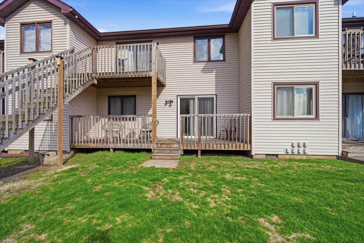1600 Northbrook Drive, Unit B9 Normal, IL 61761 - Photo 23 of 24 a view of a house with a yard and deck