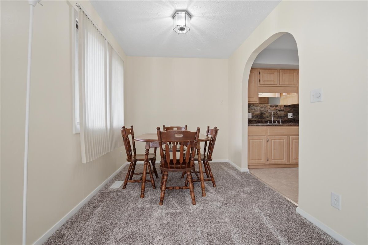1600 Northbrook Drive, Unit B9 Normal, IL 61761 - Photo 7 of 24 a dining room with furniture and window