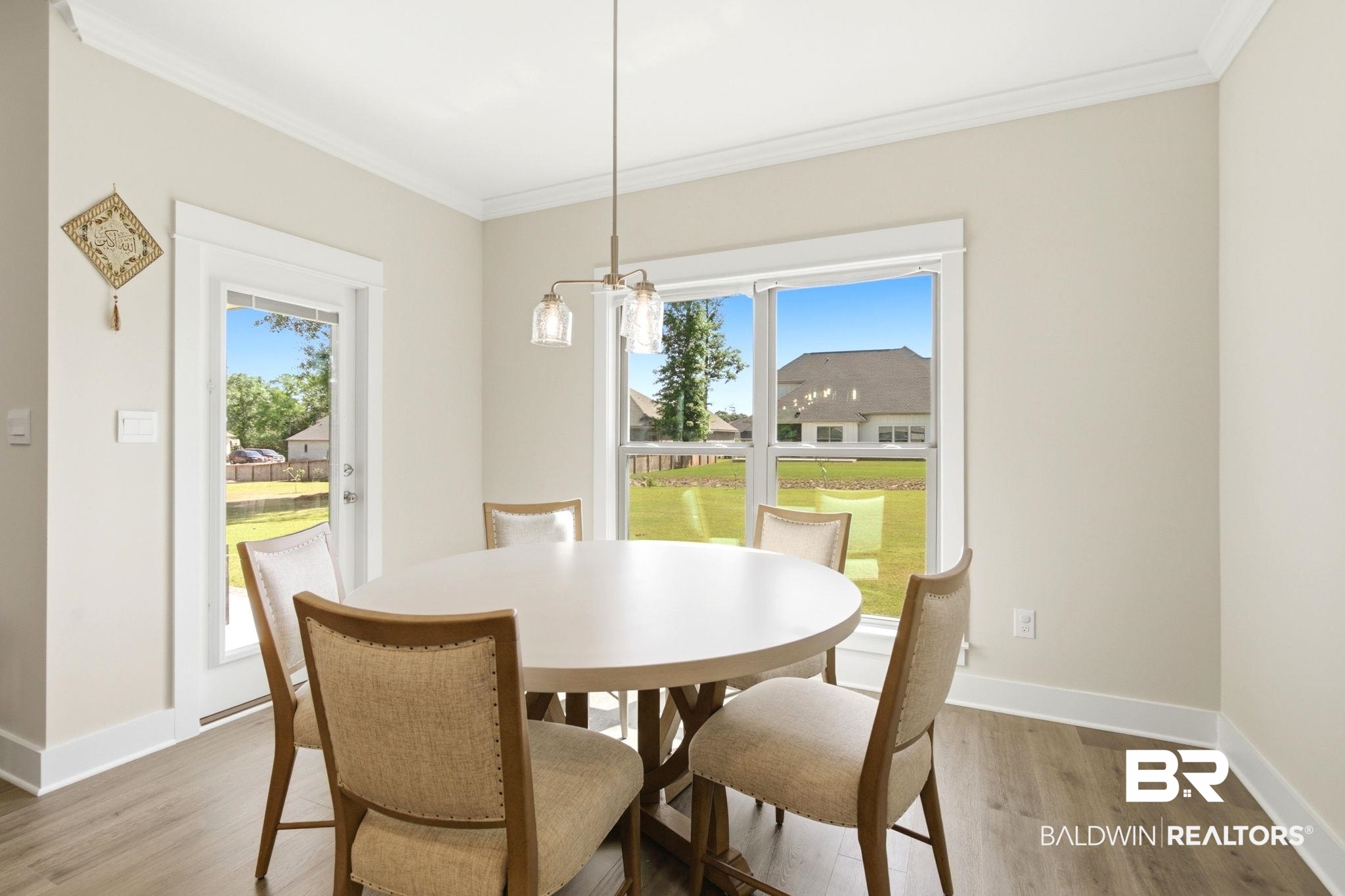 12132 Exbury Way Daphne, AL 36527 - Photo 13 of 47 Dining area with ornamental molding and light wood-type flooring