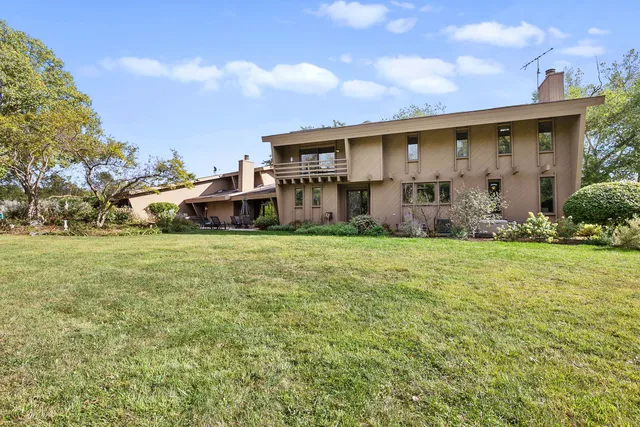 a front view of house with yard and seating area