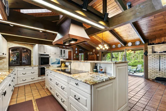 a view of living room with granite countertop lots of clutter