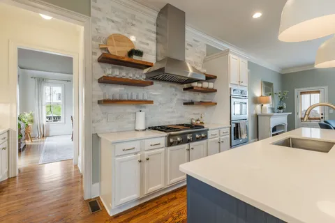 a spacious bedroom with a bed and a cabinets