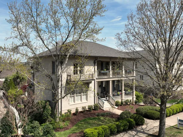 a view of a balcony with a floor to ceiling window and wooden fence