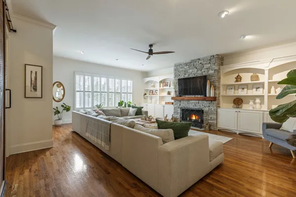 a spacious bedroom with a bed and a cabinets