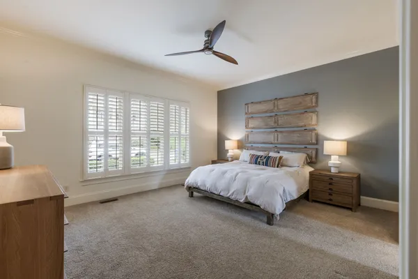 a living room with a table and chairs
