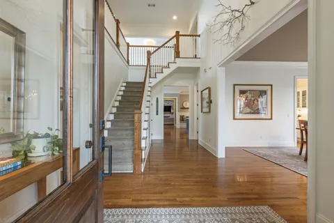 a living room with fireplace furniture and a flat screen tv