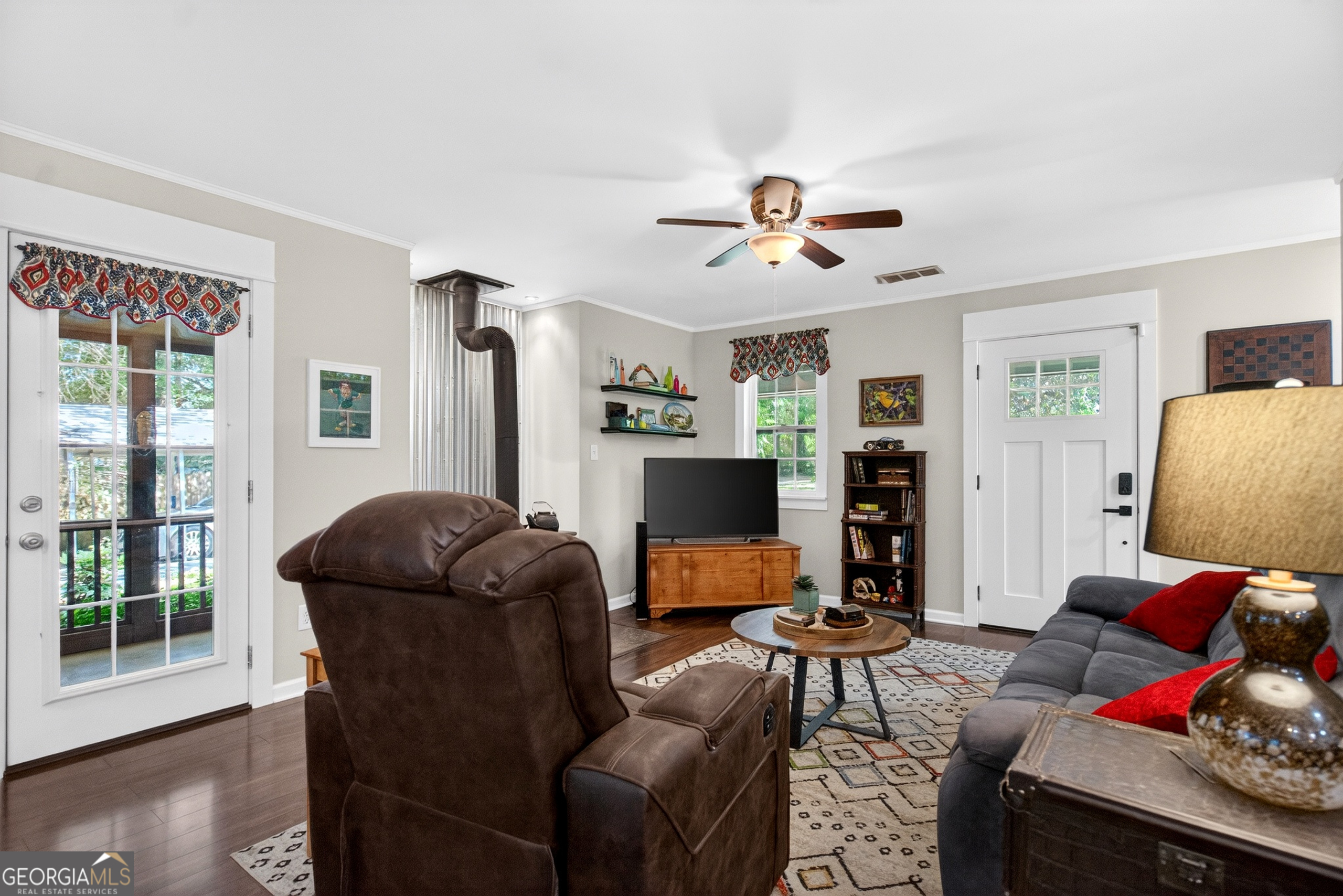4656 Greenville Road LaGrange, GA 30241 - Photo 7 of 34 a living room with furniture a ceiling fan and a window
