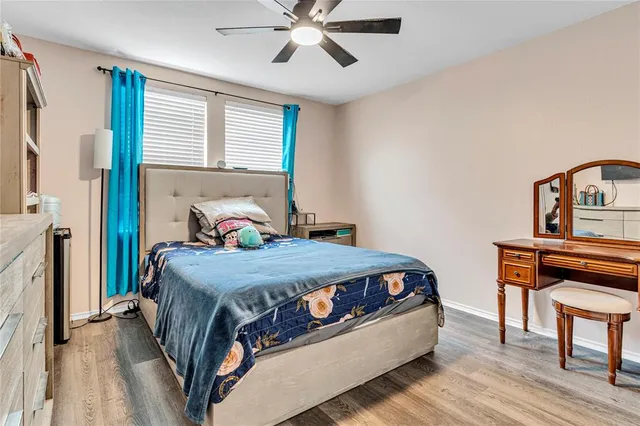 a bedroom with a bed and a desk