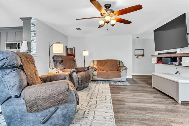 a bedroom with furniture and a flat screen tv