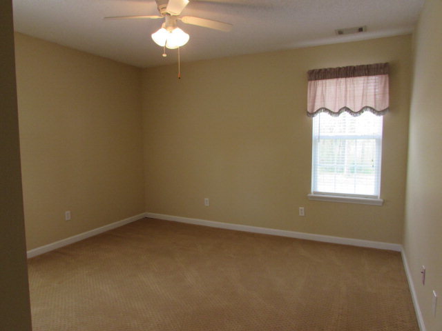 225 Gordon Road Forsyth, GA 31029 - Photo 22 of 23 an empty room with a window