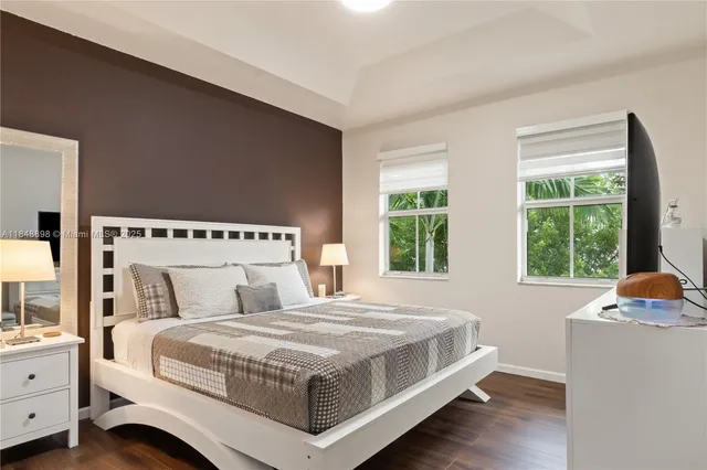 a bedroom with bed and window