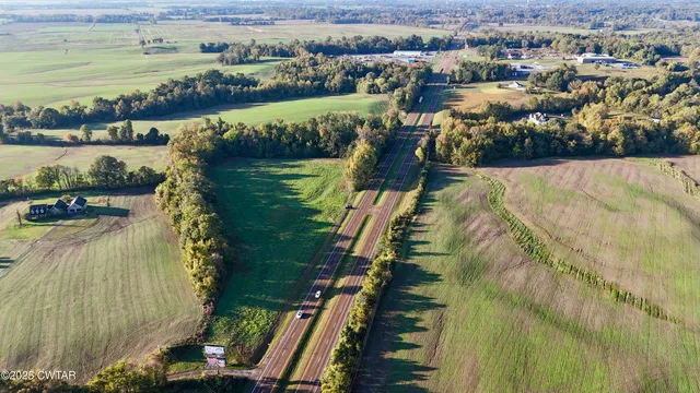 a view of a lake with a yard