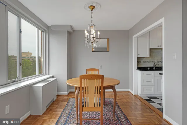 a view of a dining room with furniture window and outside view