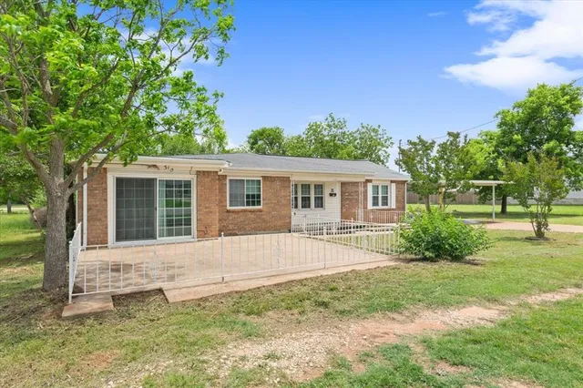 front view of a house with a yard