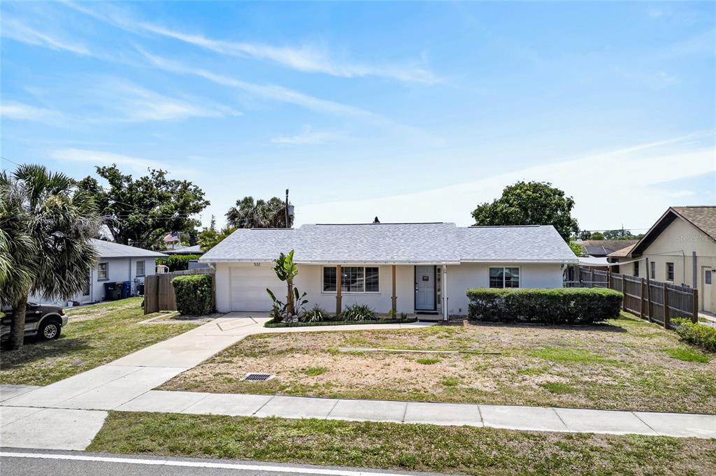 532 Center Road Venice, FL 34285 - Photo 5 of 68 a front view of a house with a yard