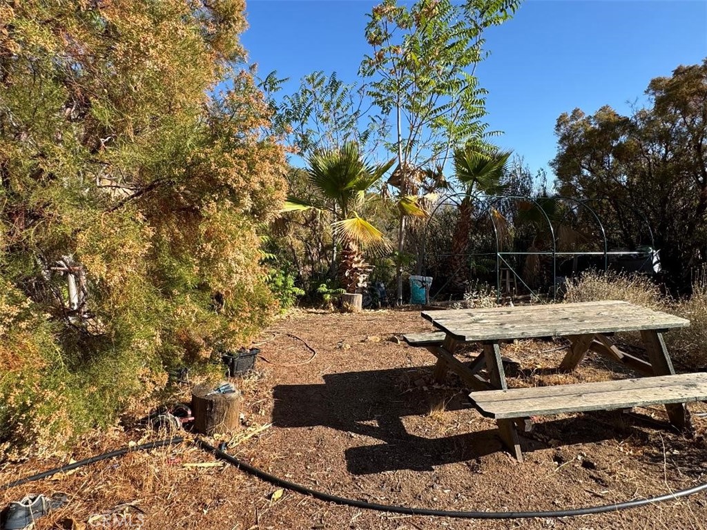 a view of a backyard with sitting area