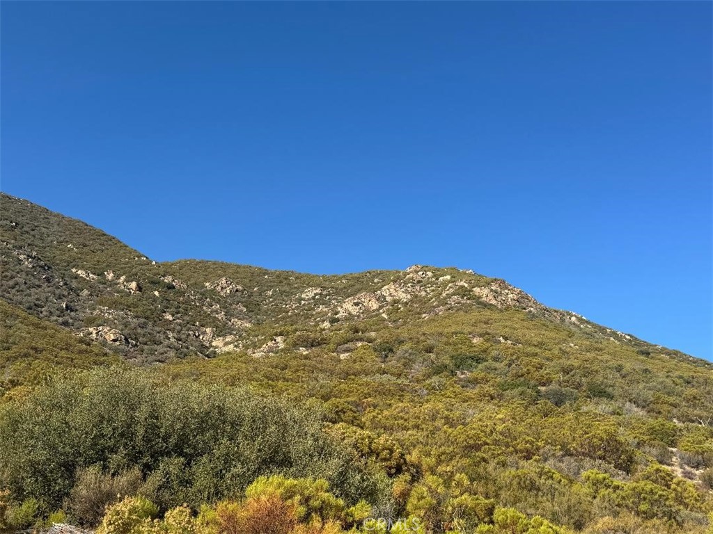 45740 Chapman Road Anza, CA 92539 - Photo 7 of 15 a view of a large building with mountains in the background