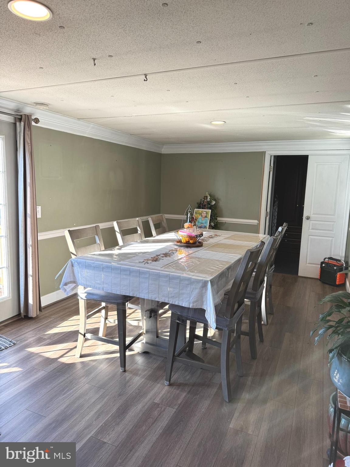 1800 Bel Air Road, Unit 66 Woodbridge, VA 22191 - Photo 8 of 18 a view of a dining room with furniture and wooden floor