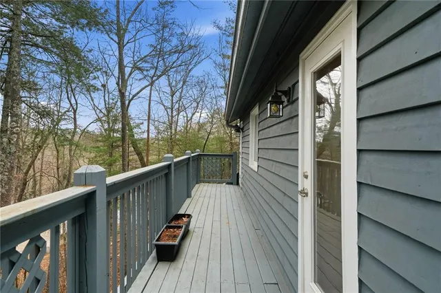 a view of a balcony with chairs