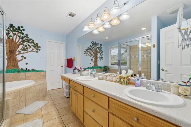 a bathroom with a bathtub and a shower
