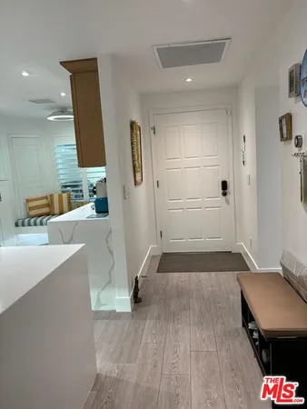 a hallway with a view of living room