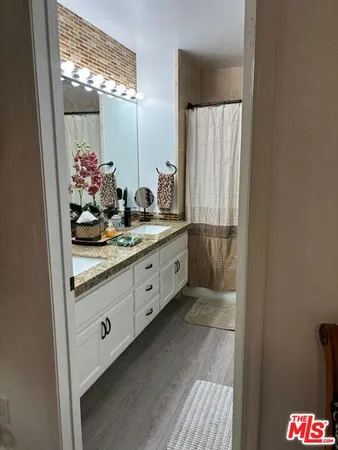 a bathroom with a toilet sink and shower