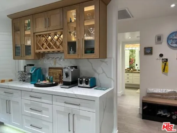 a kitchen with sink and cabinets