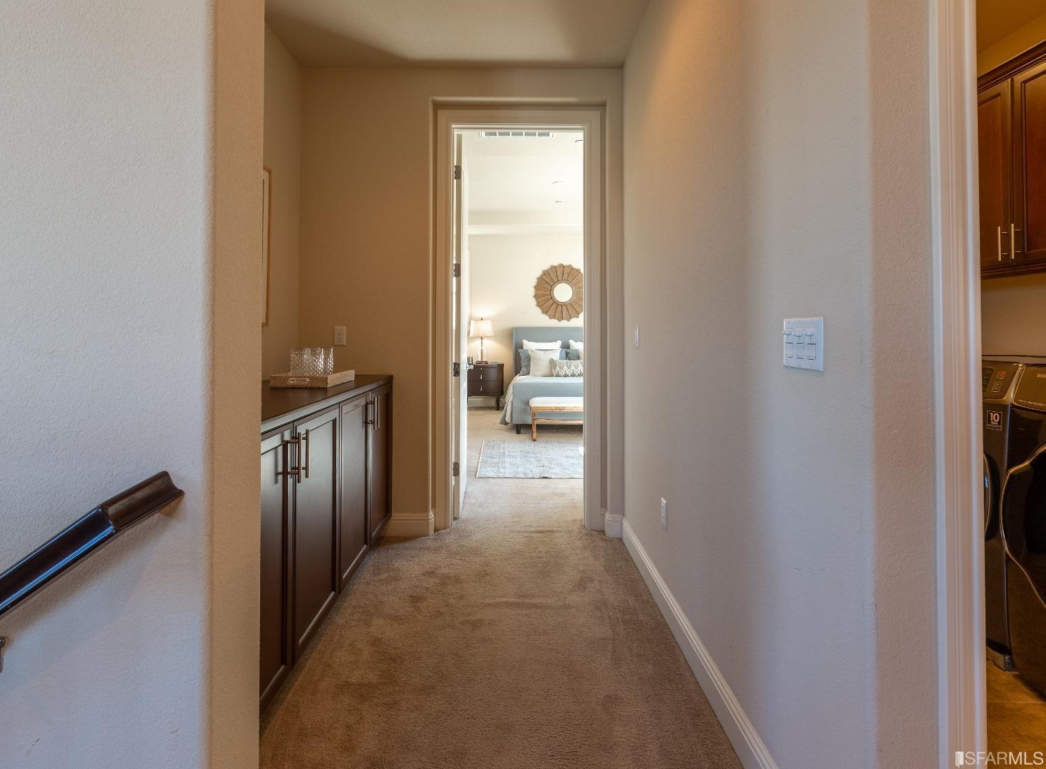 4456 Sunset View Drive Dublin, CA 94568 - Photo 18 of 40 a view of a hallway with wooden floor and a bathroom