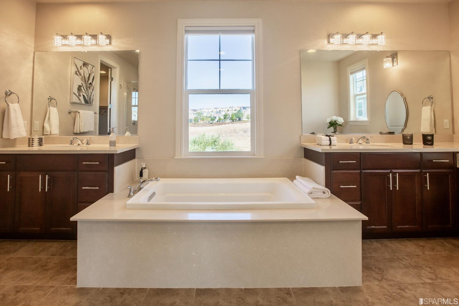 4456 Sunset View Drive Dublin, CA 94568 - Photo 22 of 40 a spacious bathroom with a bathtub sink and mirror